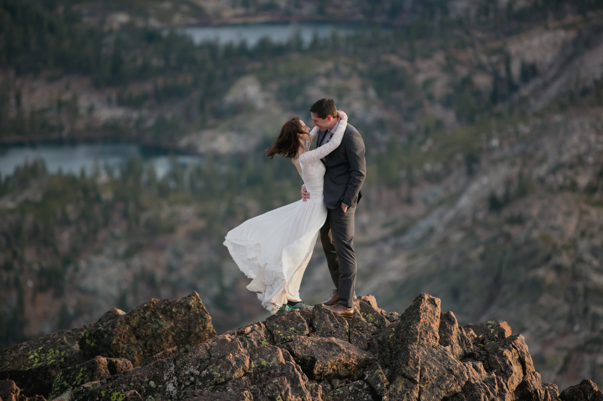 Newlyweds on a windy California mountaintop.